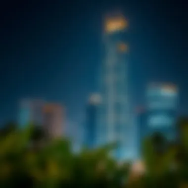 Night view of Al Fardan Building illuminated against the Dubai skyline