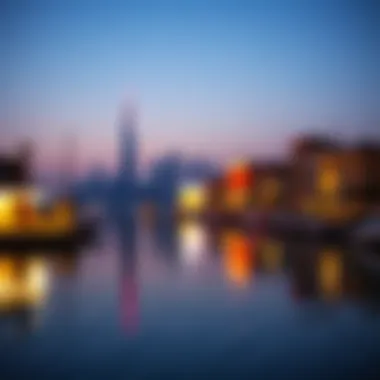 A tranquil evening view of the Al Seef skyline reflecting on the water.